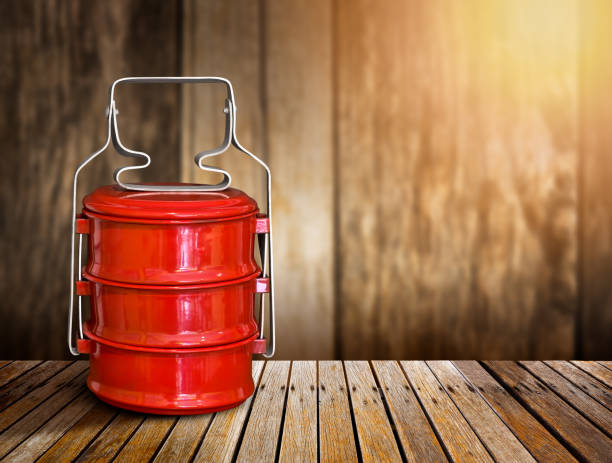 istock Red vintage tiffin carrier 990442188