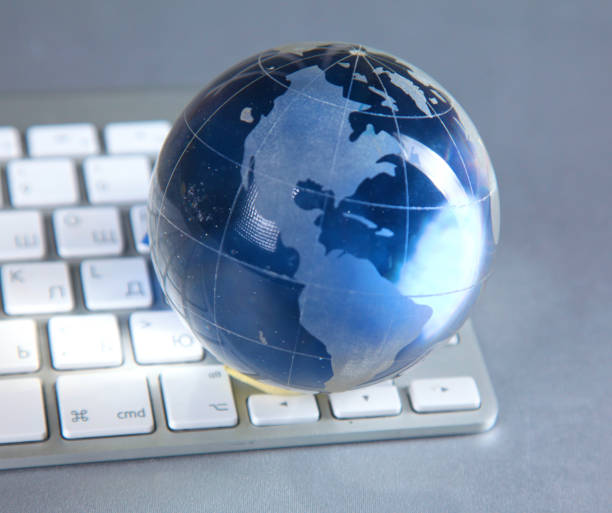 istock Cristal globe of the Earth on a Computer 990442220