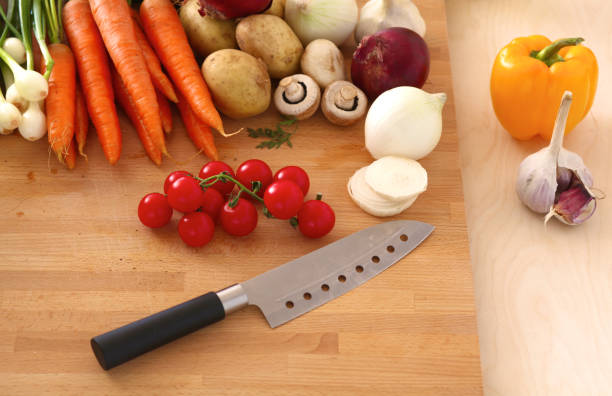 istock Pile of organic vegetables on a wooden table 990445708