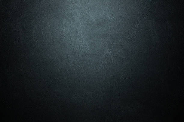 istock black paper texture or background with spotlight, dark tone 990451082