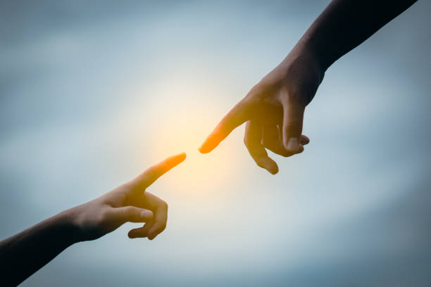 istock Hand to hand holding connect relationship 990454394