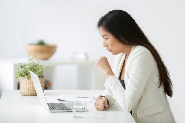 istock Asian female feeling stunned after reading unexpected news 990458494
