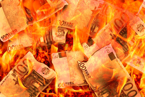 istock 100 euro banknotes burning in flames 990463078