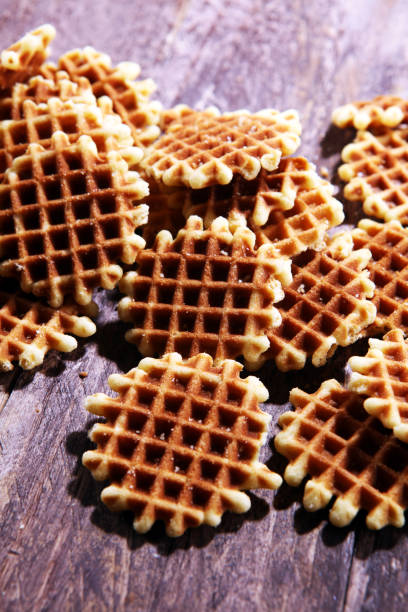 istock Traditional belgian waffles on wooden background 990466816