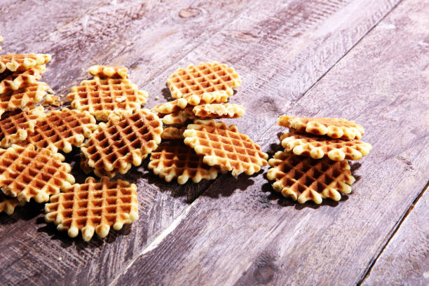 istock Traditional belgian waffles on wooden background 990466884
