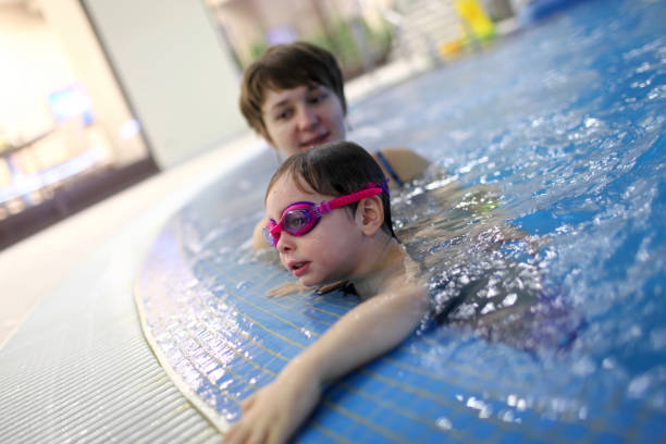 istock Family in the pool 990469972