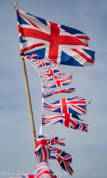istock Union Flag National British Flag and sky 990472876