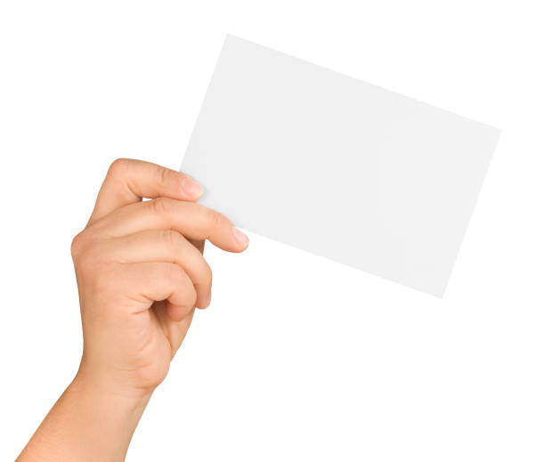 istock hand holding and showing tilted large white blank card isolated 990473888