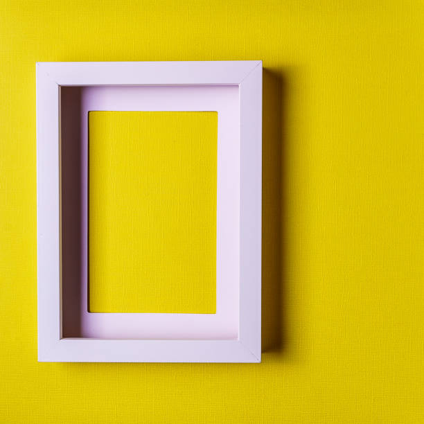 istock Abstract minimalism colofrul paper background with empty picture frame. 990476836