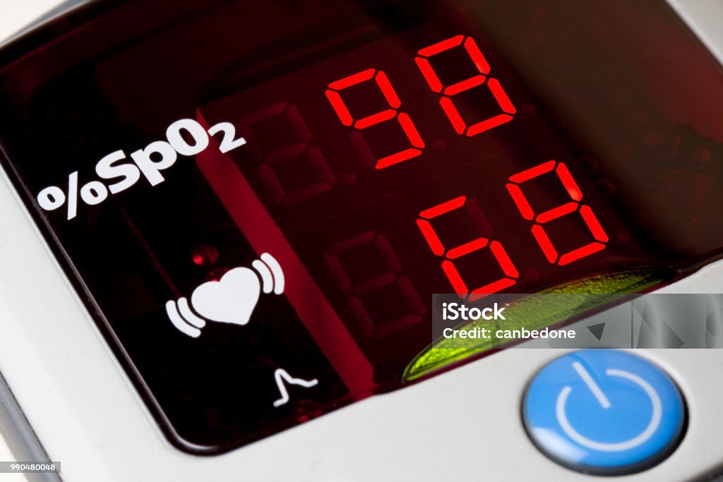 Closeup of display of pulse oximeter to measure pulse rate and blood oxygen saturation Blood Stock Photo