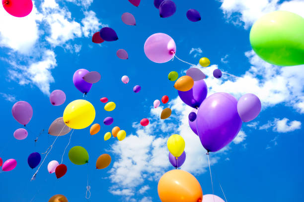 istock Colorful Balloons flying in the sky party 990480064