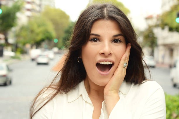 istock Beautiful young woman with surprised expression. 990481006