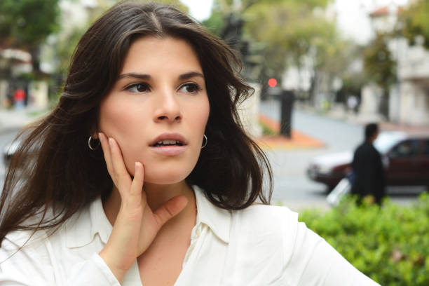 istock Young woman with surprised expression. Outdoor. 990481016