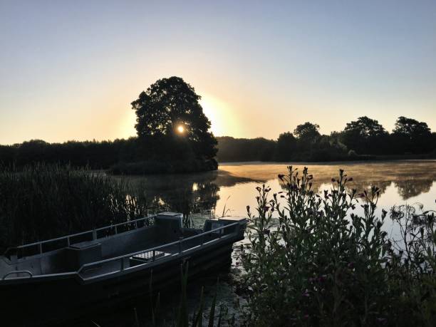 istock Sunrise over Alderford Lake 990487466