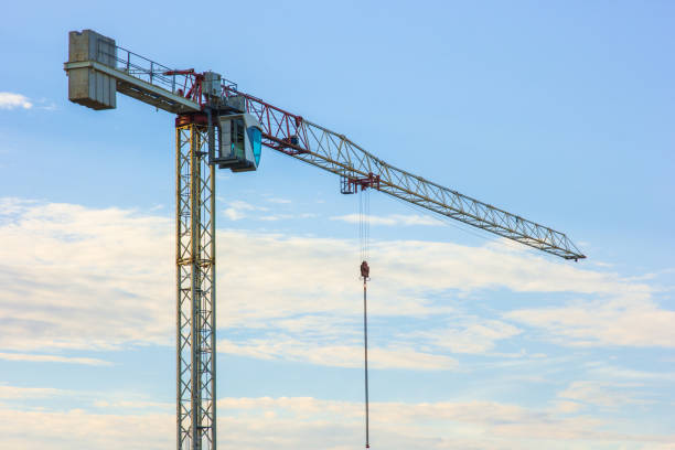 istock Construction crane against the background of the evening sky 990489268