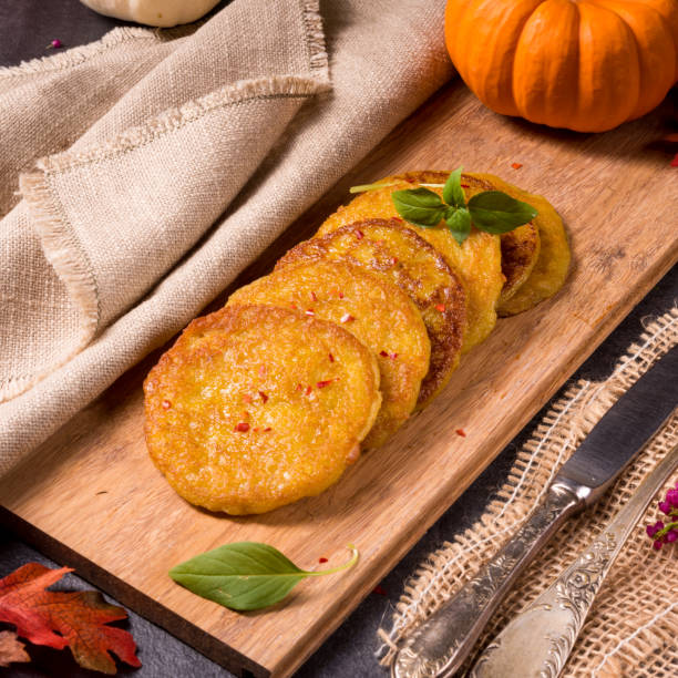 istock Potato pancakes with pumpkin puree 990491910