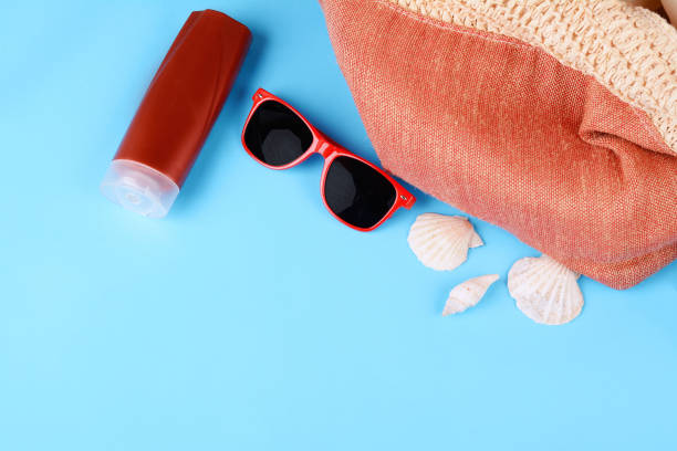 istock Top view of sunglasses, shells and starfish 990505172