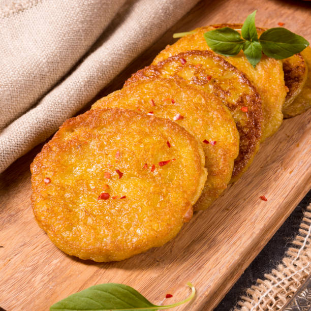 istock Potato pancakes with pumpkin puree 990505200