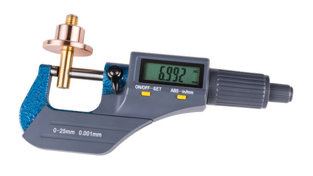 Digital micrometer and shiny metal workpiece. Isolated on white background stock photo