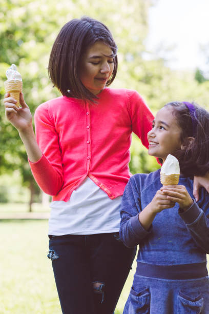 istock Girls eating ice-cream 990537044