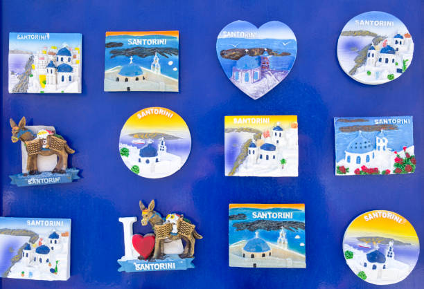 istock Many magnets from Santorini, Greece on blue background 990545602