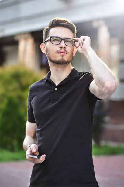 istock Young cute man stay at street 990549580