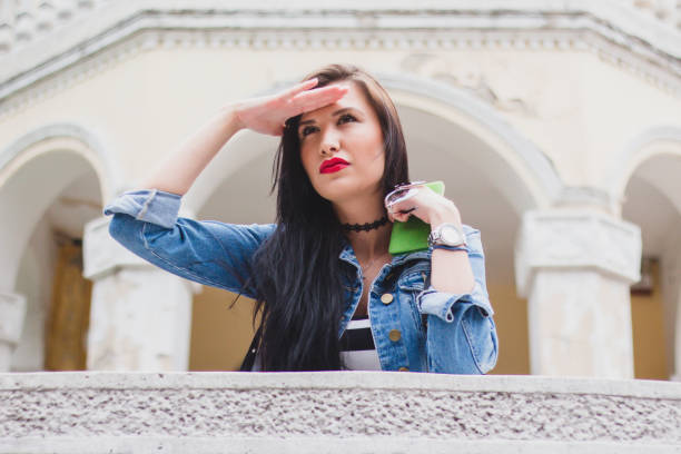 istock Young woman relaxing on balcony. 990550472