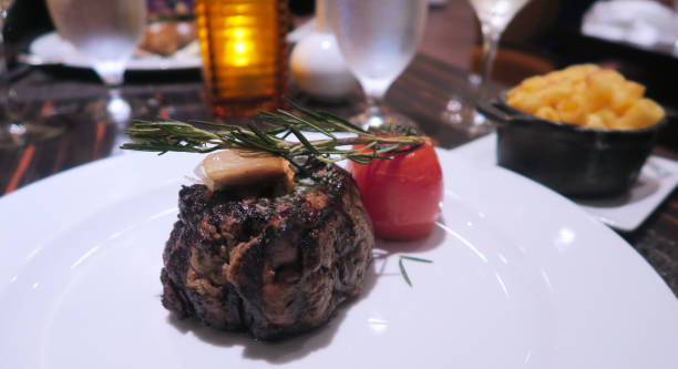 istock Filet Mignon with tomato and rosemary garnish 990558134