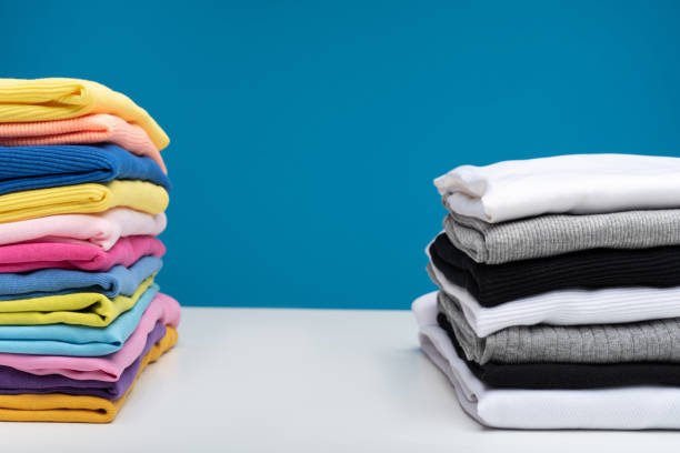 istock Piles of clean clothes after laundry 990558598