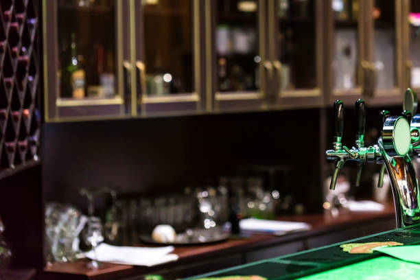 Chrome beer taps in modern bar