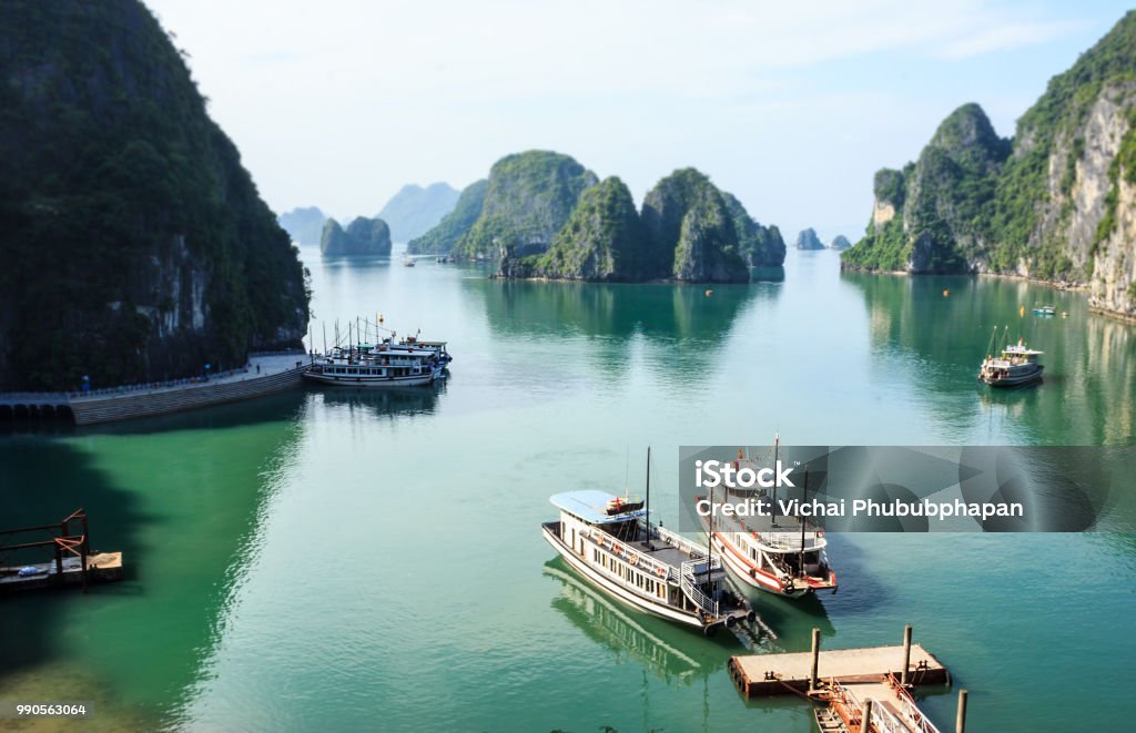 Panoramic view of Ha Long Bay islands, tourist boat and seascape from Bo Hon Island, Ha Long, Vietnam. Vietnam Stock Photo