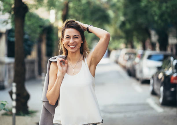 istock Happy woman outdoors on a sunny day 990564684