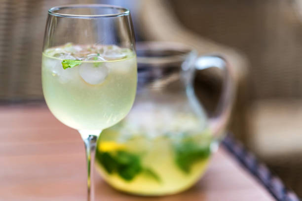 Close up Mojio with ice in glass and jug on restaurant table