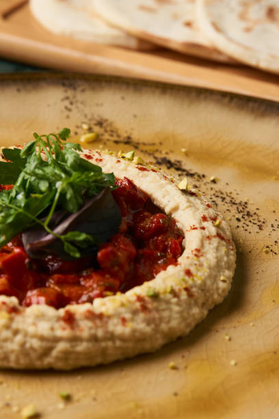 istock Delicious Hummus with harissa sauce and pistachios 990568944
