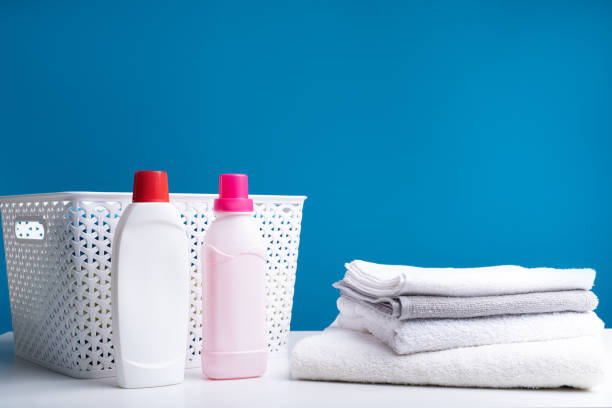 istock Detergents lying near bath towels 990569680