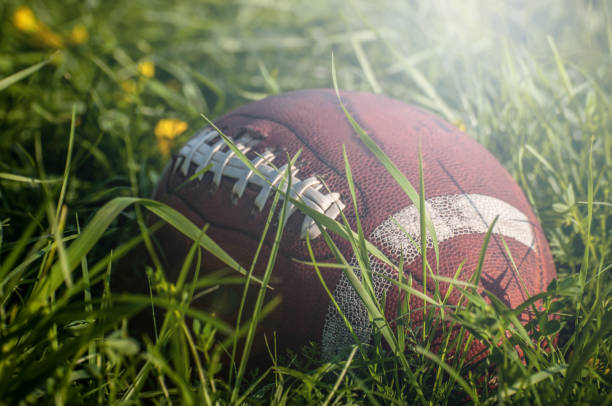 istock American Football in grass 990580678