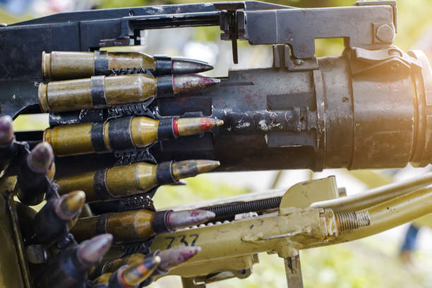 istock tape with cartridges loaded into a machine gun 990589848