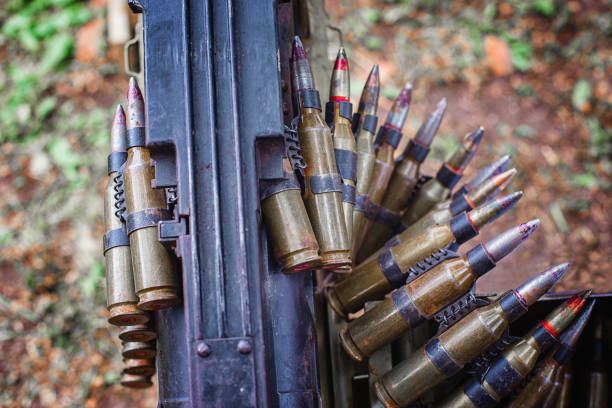 istock tape with cartridges loaded into a machine gun 990590312