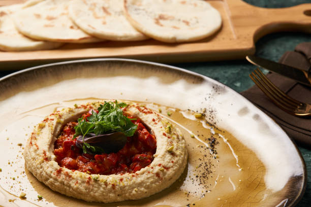 istock Vegetarian Hummus with harissa sauce and pistachios 990595896
