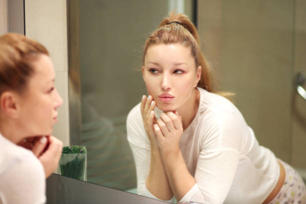 istock Magic anti-aging cream.Applying the cream 990598878