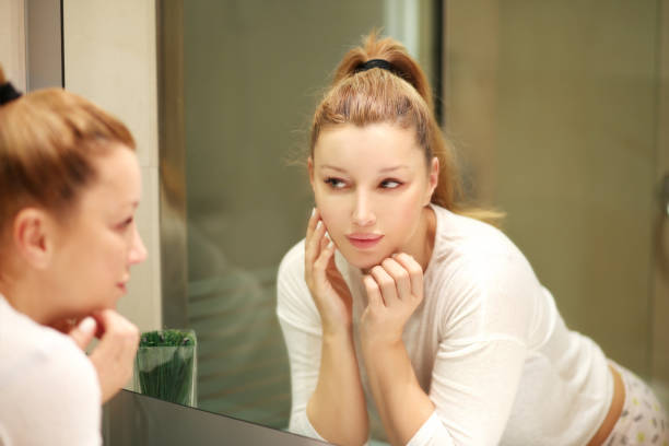 istock Magic anti-aging cream.Applying the cream 990598882