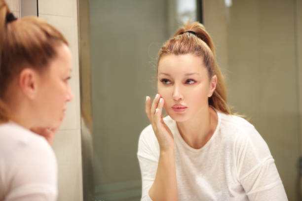 istock Magic anti-aging cream.Applying the cream 990598896