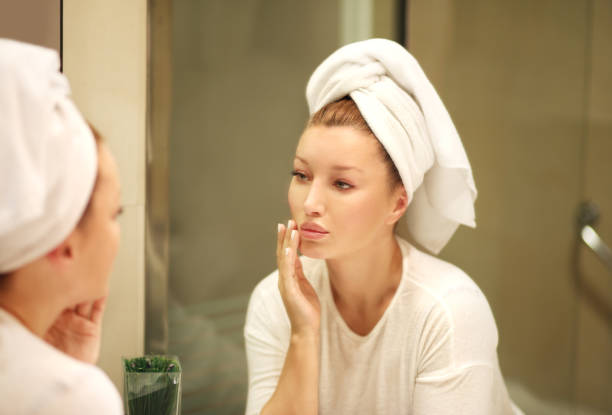 istock Magic anti-aging cream.Applying the cream 990598900