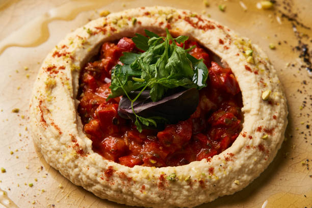 istock Vegetarian Hummus with harissa sauce and pistachios 990615144