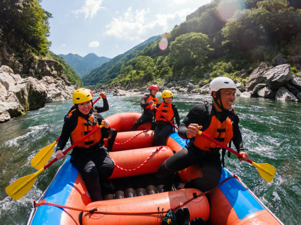 personal point of view of a white water river rafting excursion - teamwork rafting cooperation sport imagens e fotografias de stock