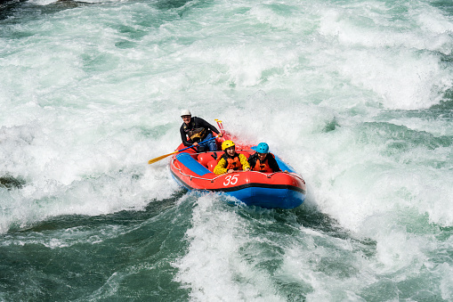 Married couple on a guided white water river rafting tour in Japan.