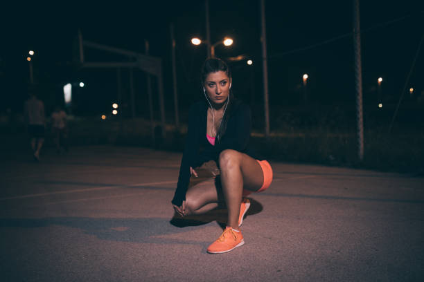 istock Fit girl exercising at night 990659640