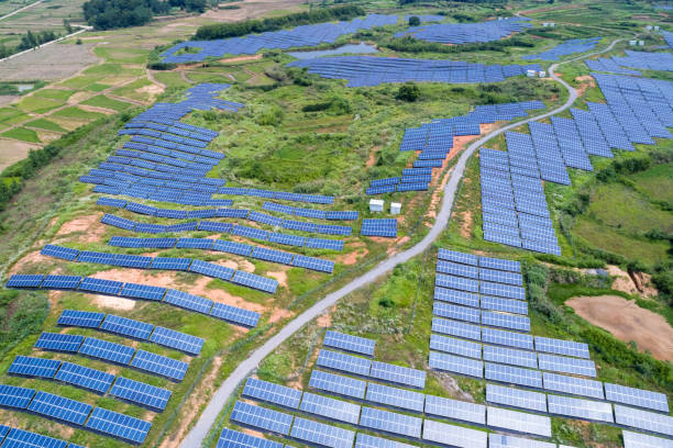 istock aerial view of solar power panels on hillside 990677906