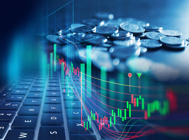 istock double exposure image of stock market investment graph and coins stack. 990707984