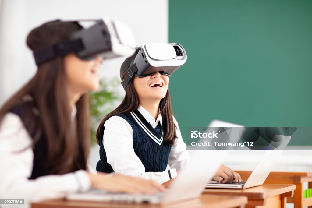 teenagers student with virtual reality headset in classroom Technology Stock Photo